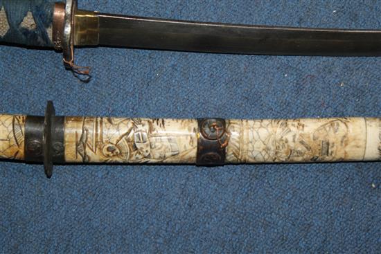 An early 20th century Japanese bone wakizashi and another